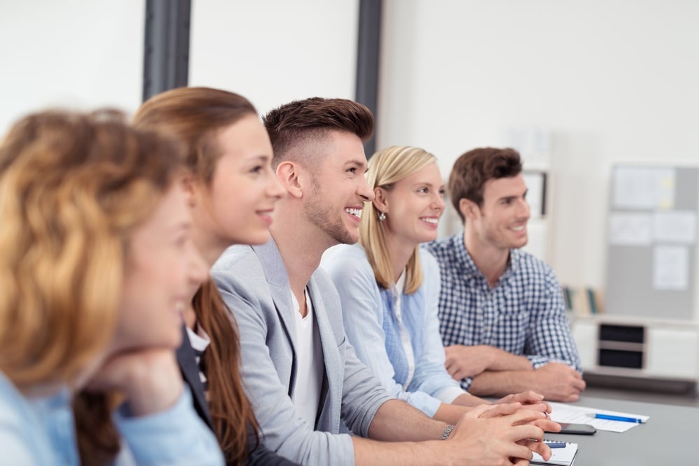 Young Office People with Happy Facial Expressions Listening to Someone Discussing to them Inside the Office.jpeg